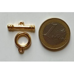Cierre dorado en T